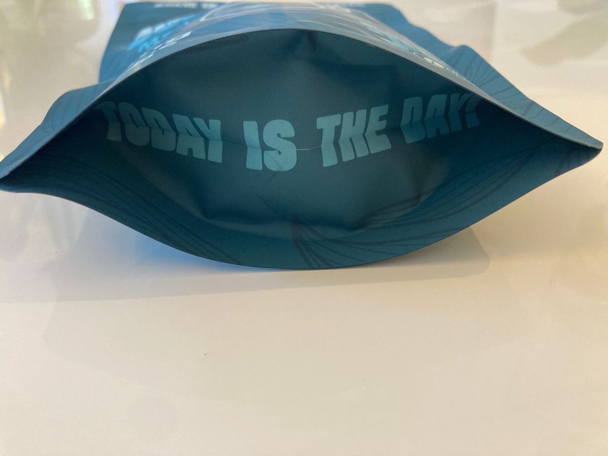 Base of the blue Cups Full Peace pouch printed with 'Today is the day'
