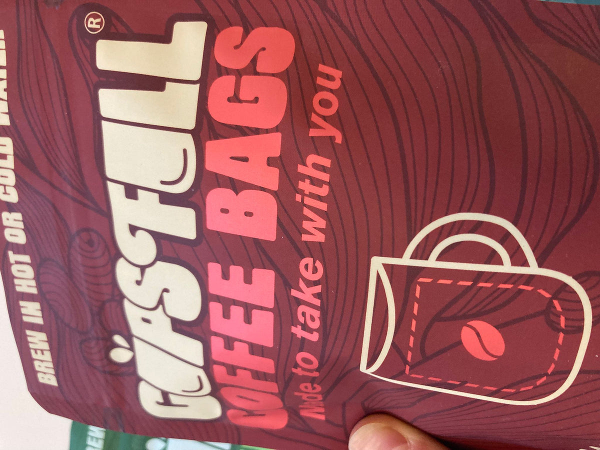 Close-up of the Cups Full Power pouch front with the mug logo