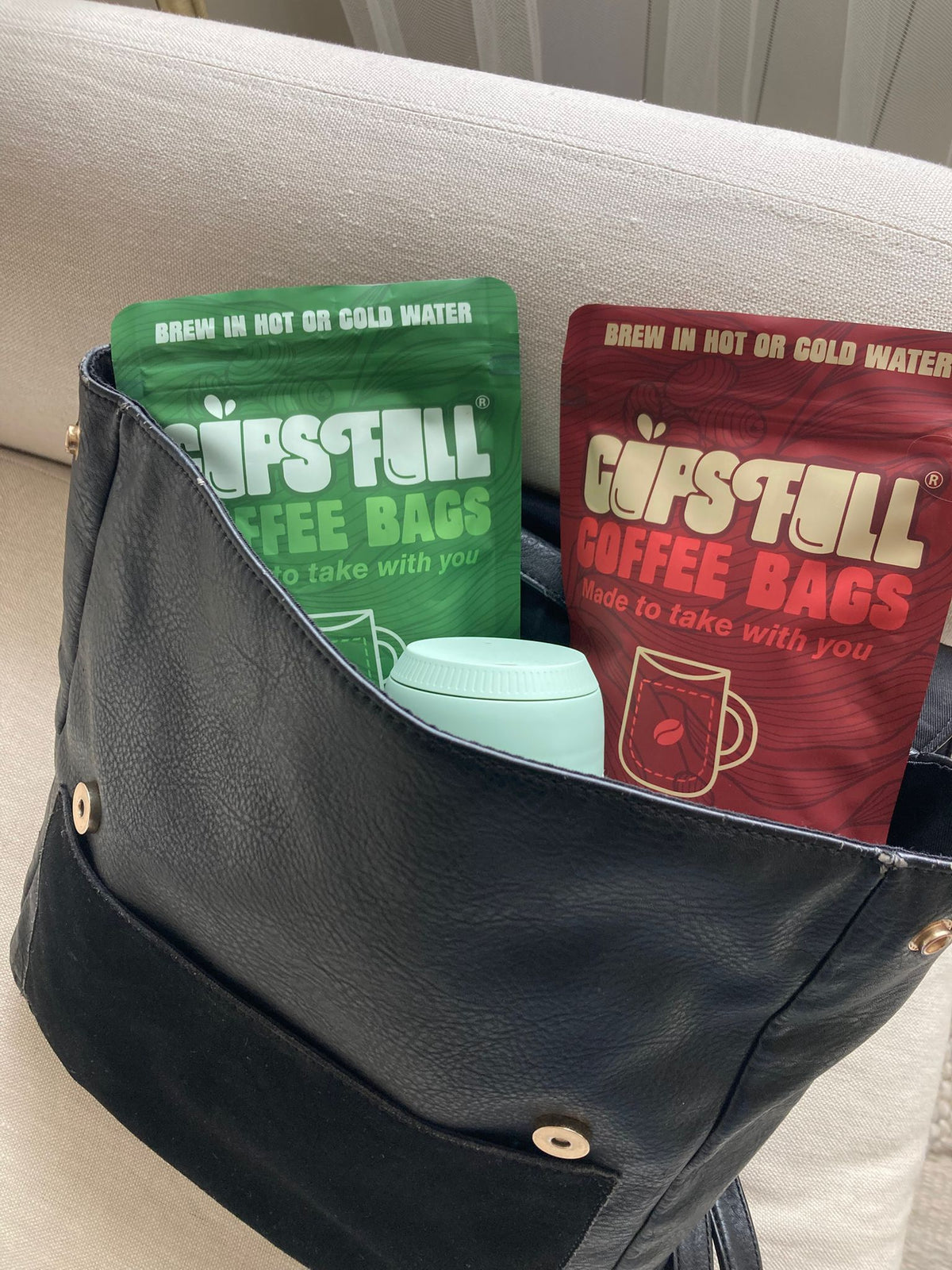 Cups Full coffee bag pouches packed in a bag, ready to take anywhere